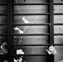 A cuddly toy hung on the burnt gym bars in the sports hall of School No. 1, Beslan, North Ossetia, September 2004